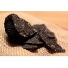 Slices of dried black winter truffle or brumale from Provence